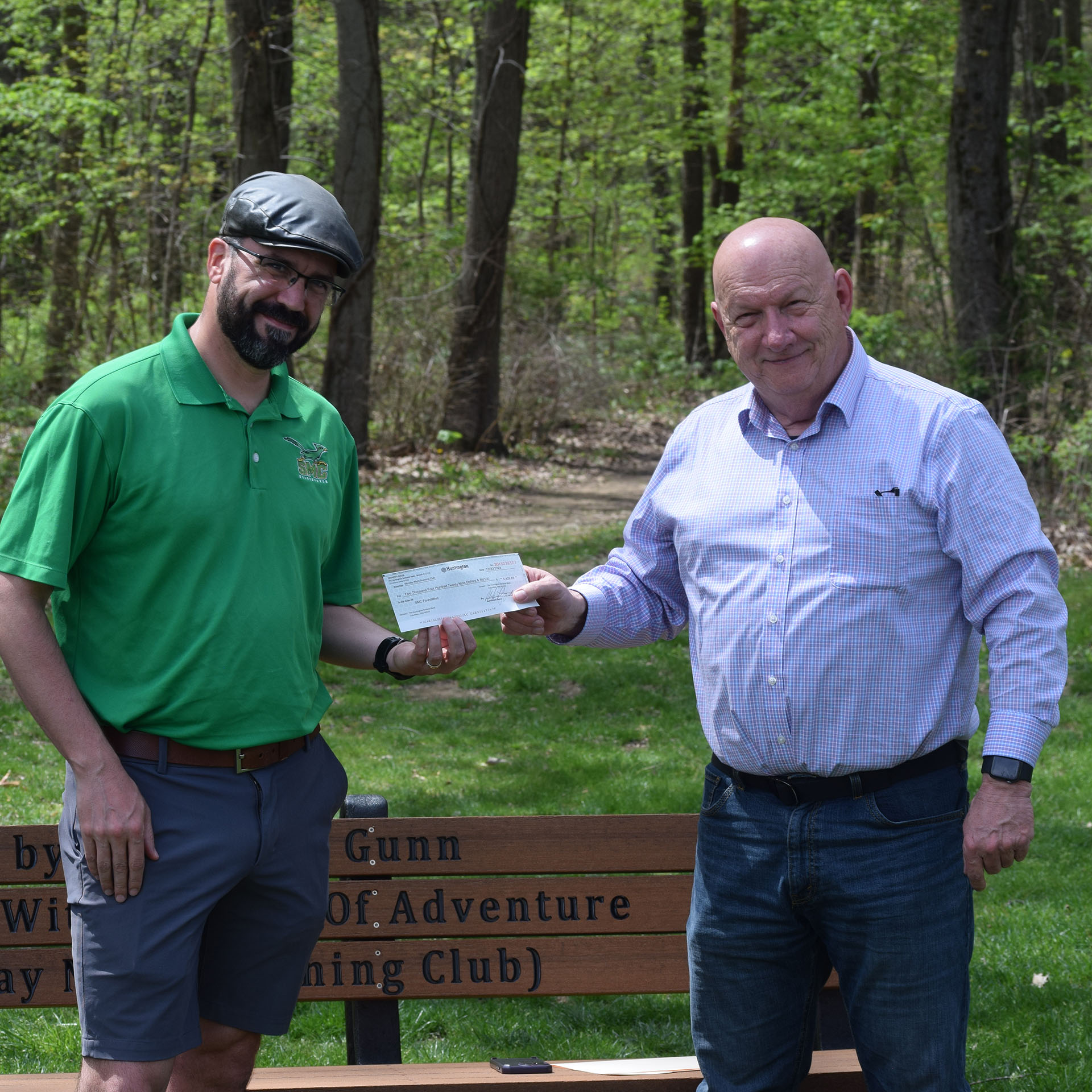 Zac Sartori accepts check from Thom Janssen